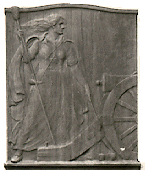 Margaret Corbin's grave marker bronze showing woman at cannon